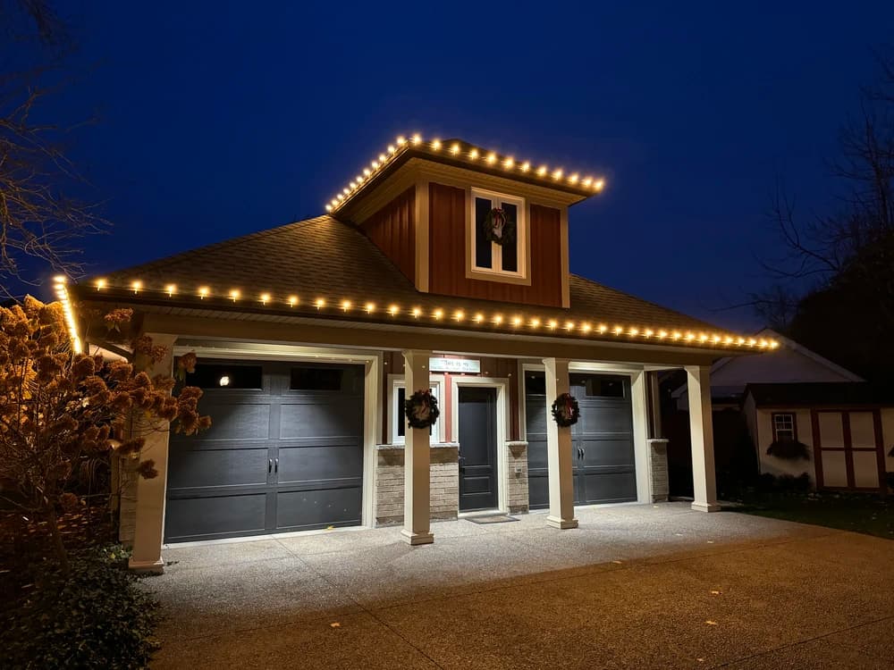Christmas light installers working on a Niagara-on-the-Lake home