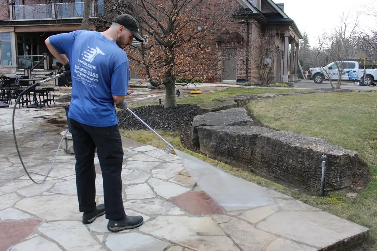 Professional pressure washing service on a patio in Niagara